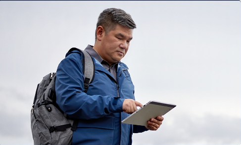 Man using Windows 11 Pro tablet